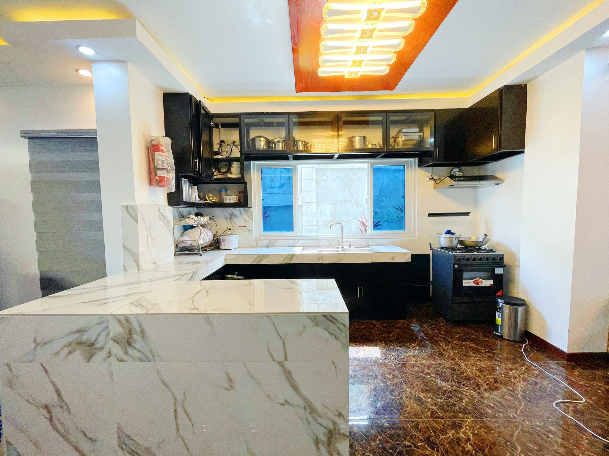 The fully-equipped resort kitchen with marble counters